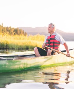 Man in canoe on water